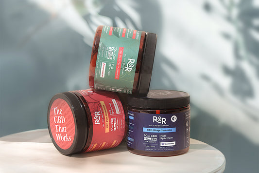 R&R CBD pain-relief, stress-relief, and sleep gummies are kept on a table