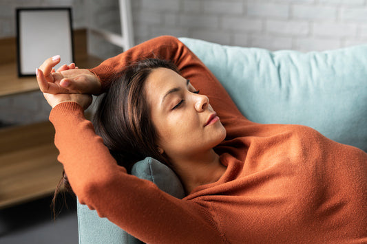 Woman sleeping on a couch.