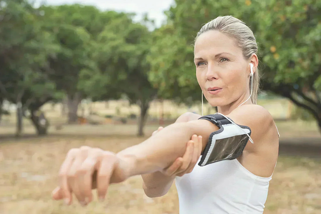 A lady wearing a breathable sports armband while exercising